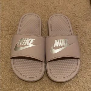 Pinkish purple Nike slides